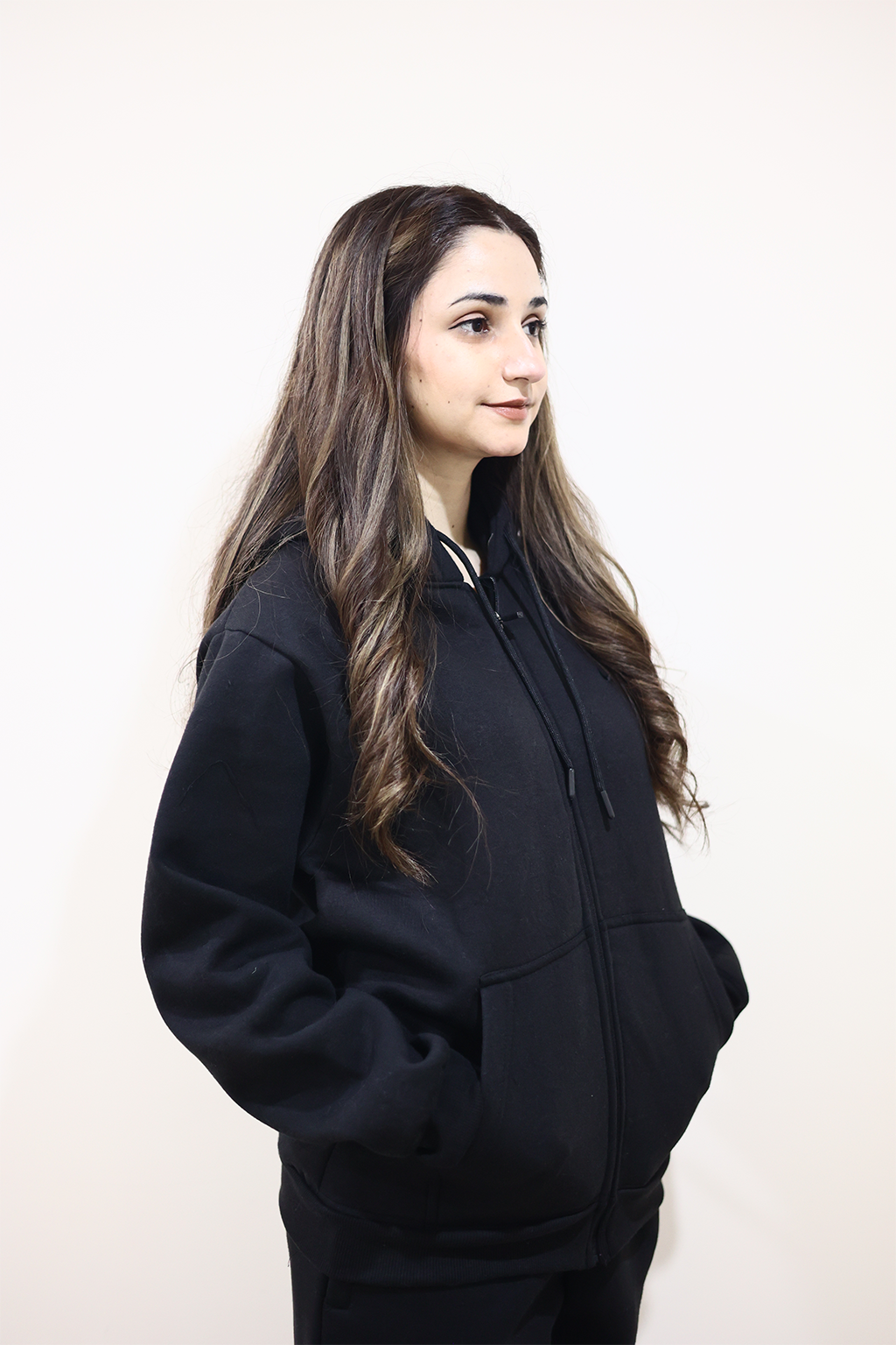 Side view of Model wearing Nxtwears Black Zipper Hoodie