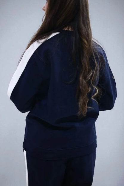 Back view of female model wearing Sweat shirt with matching trouser