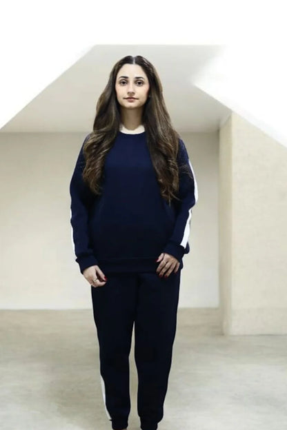 Female Model wearing Nxtwears navy blue unisex sweatsuit with white stripes  full outfit winter look for men and women