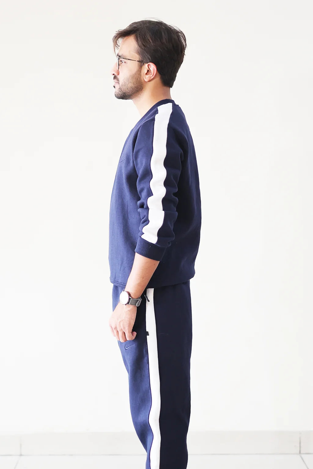 Side view of Nxtwears navy blue unisex sweatsuit with contrasting white stripe detailing for men and women