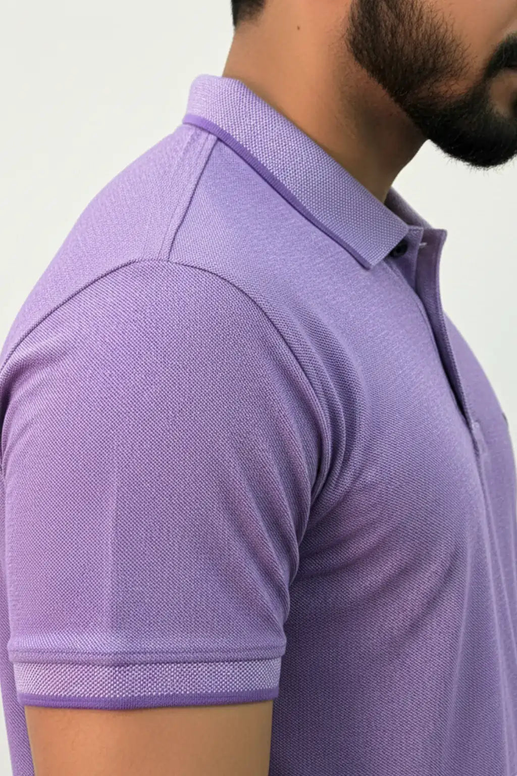 Model posing for side view of Polo shirt in Purple