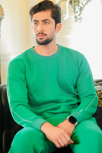 Sitting pose of Men wearing green sweatshirt