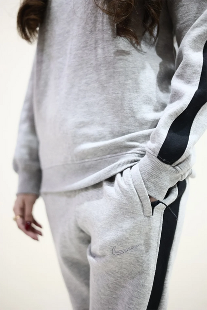 Model putting hands in pockets of Grey Trouser Pants in Fleece