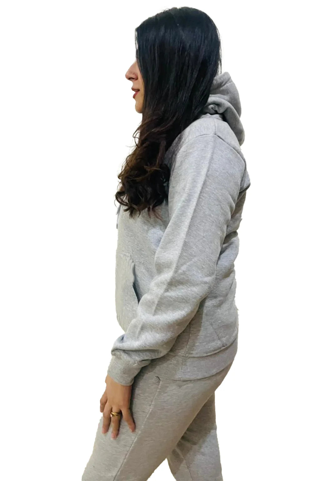 Side view of Women wearing Pullover Hoodie and Jogger pants with a plain background