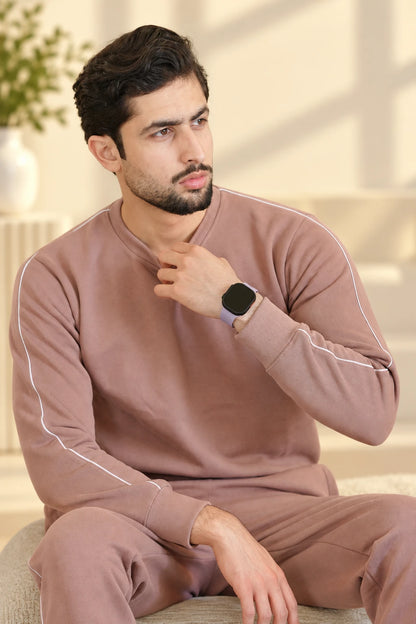 Men wearing Dusty Rose Tracksuit for Nxtwears in Sitting pose