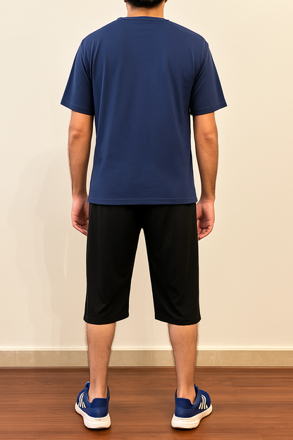 Back view of Nxtwears men’s navy cotton t-shirt and black shorts set – breathable summer outfit for men