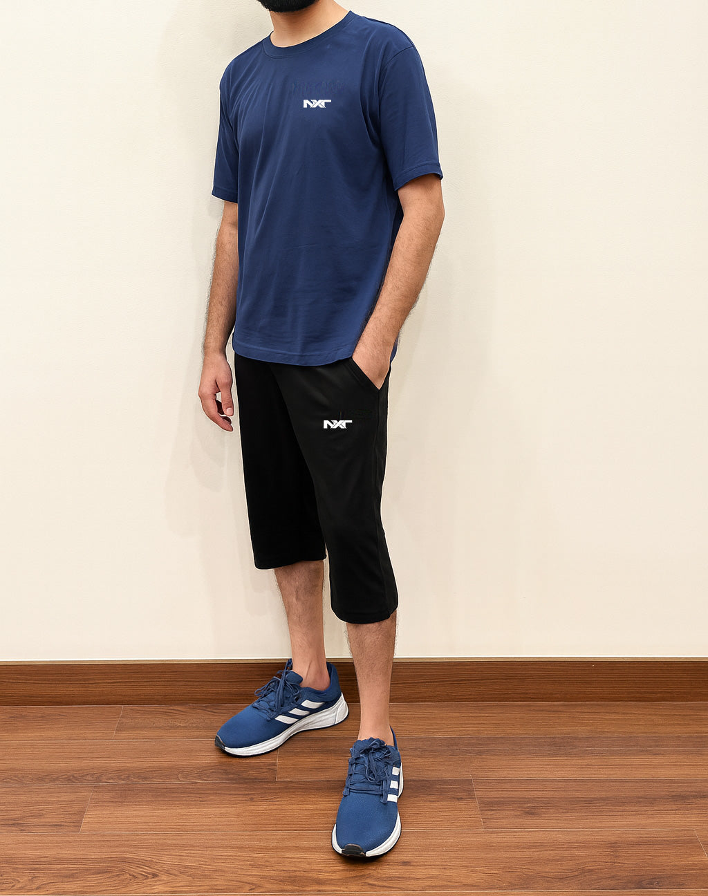 Full-length Nxtwears men’s summer cotton set – navy t-shirt, black shorts, and sports shoes casual look