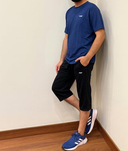 Side profile of Nxtwears men’s cotton athleisure outfit – navy t-shirt with black shorts casual wear