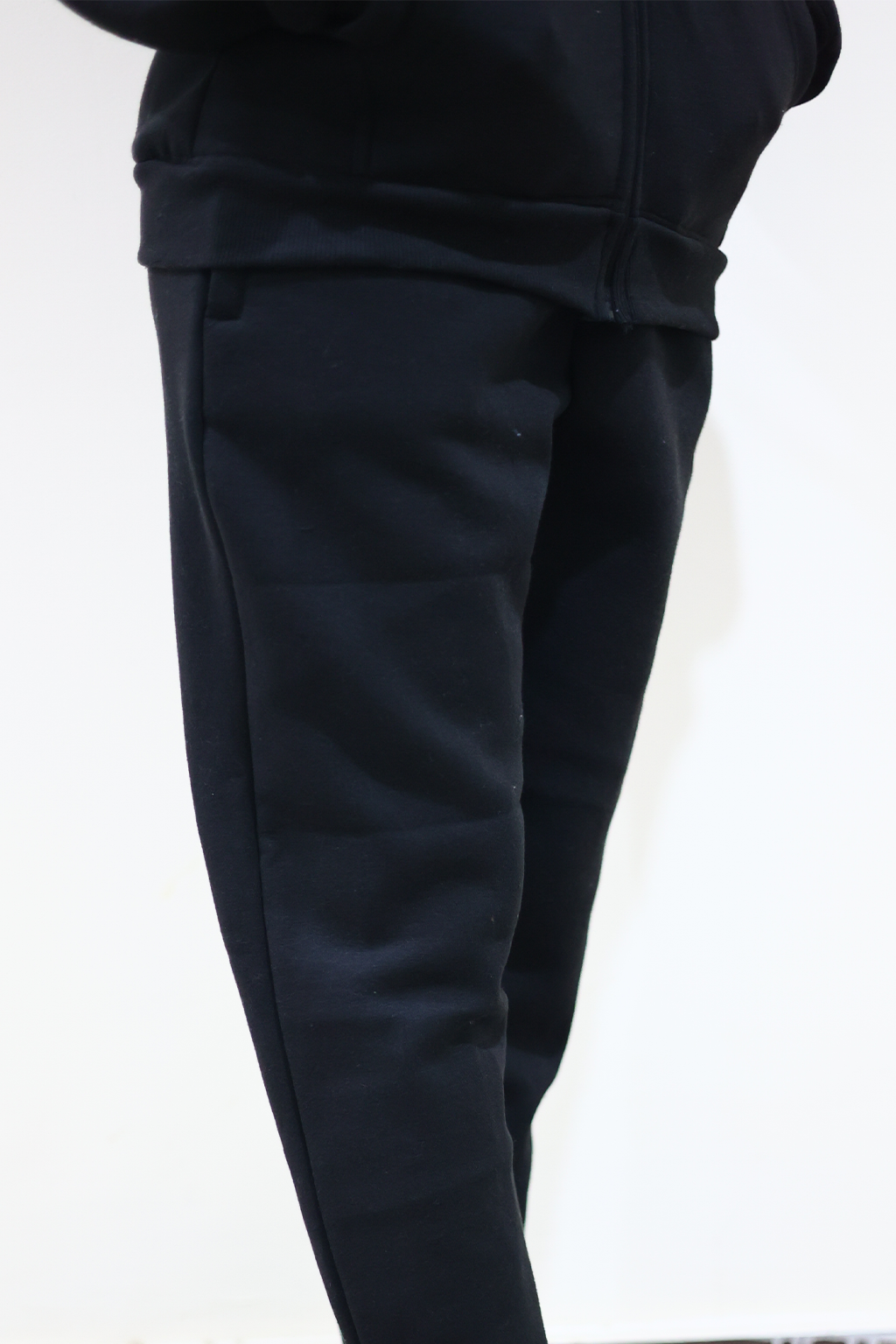 Close view of Nxtwears unisex Black zipper hoodie and pajama set wore by female model