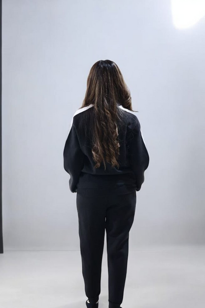 Nxtwears unisex black sweatsuit with white stripe borders back view of co-ord set female