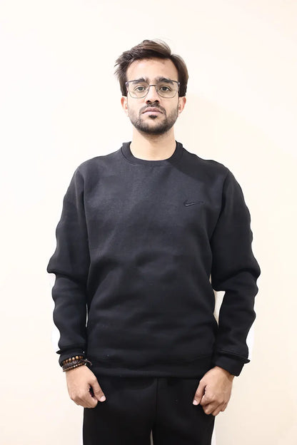 Front view of Men wearing Black Sweat Suit with Nike Logo on front in Fleece